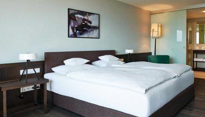 Doppelzimmer Alpin zur Südseite Bett im Doppelzimmer Alpin zur Südseite