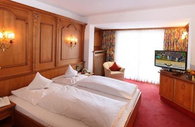 Magnolie – 24 m² Bett im Zimmer Magnolie
