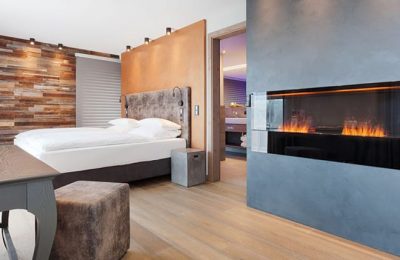 Deluxe-Zimmer & Suiten Bett in einem Deluxe-Zimmer
