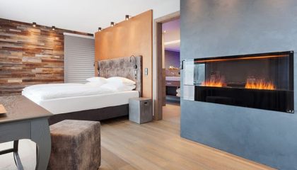 Deluxe-Zimmer & Suiten Bett in einem Deluxe-Zimmer