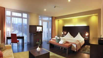 Suiten Bett und Wohnraum in der Juniorsuite Bollerberg